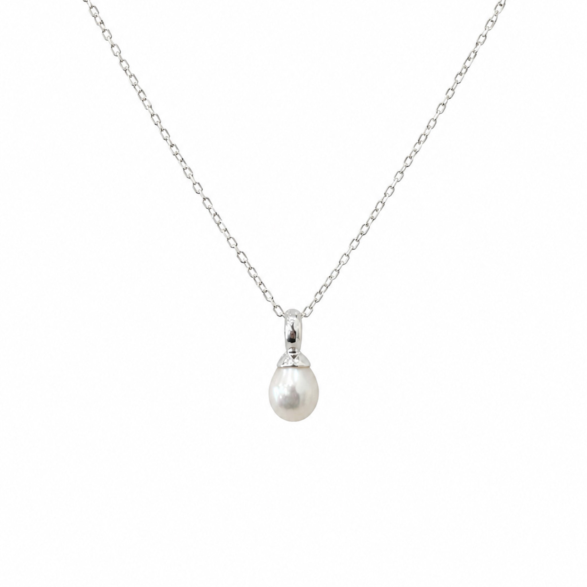 Dainty white freshwater pearl pendant necklace in sterling silver featuring a 9mm pearl on a fine silver chain