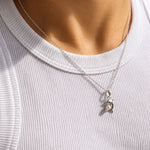 dainty dolphin pendant detailed with a pearl