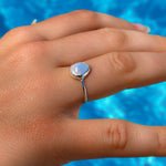model wearing the lush designs drift pearl ring which features a 9mm freshwater organic pearl set in sterling silver