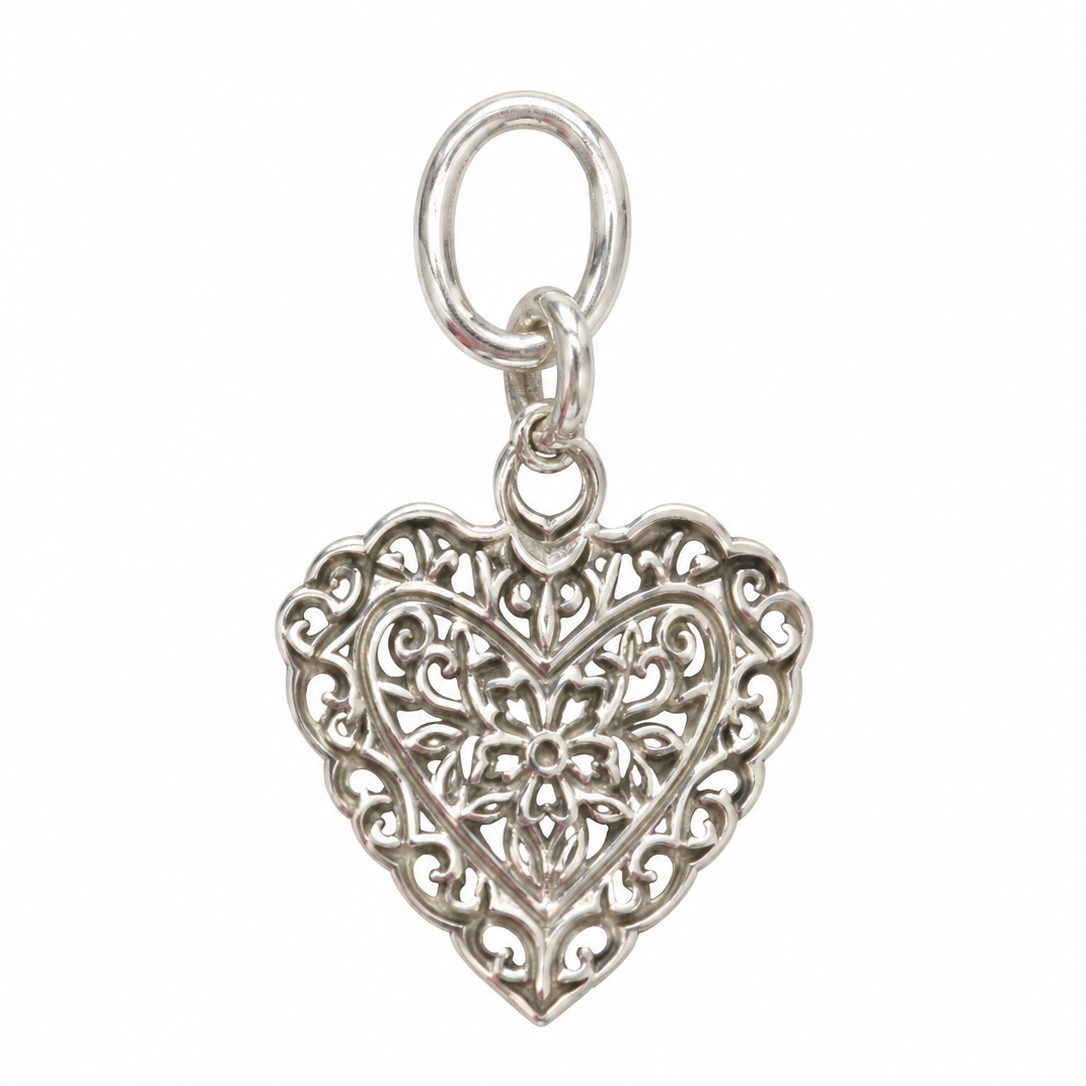 Small filigree heart pendant crafted from 925 sterling silver, featuring intricate openwork floral detailing and polished silver finish. Designed by Lush Designs Jewellery in Broome, Western Australia.