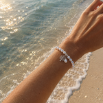 Kimberley Boab Pearl Silk Knot Adjustable Bracelet featuring genuine freshwater pearls, hand-knotted silk and sterling silver Boab tree charm.