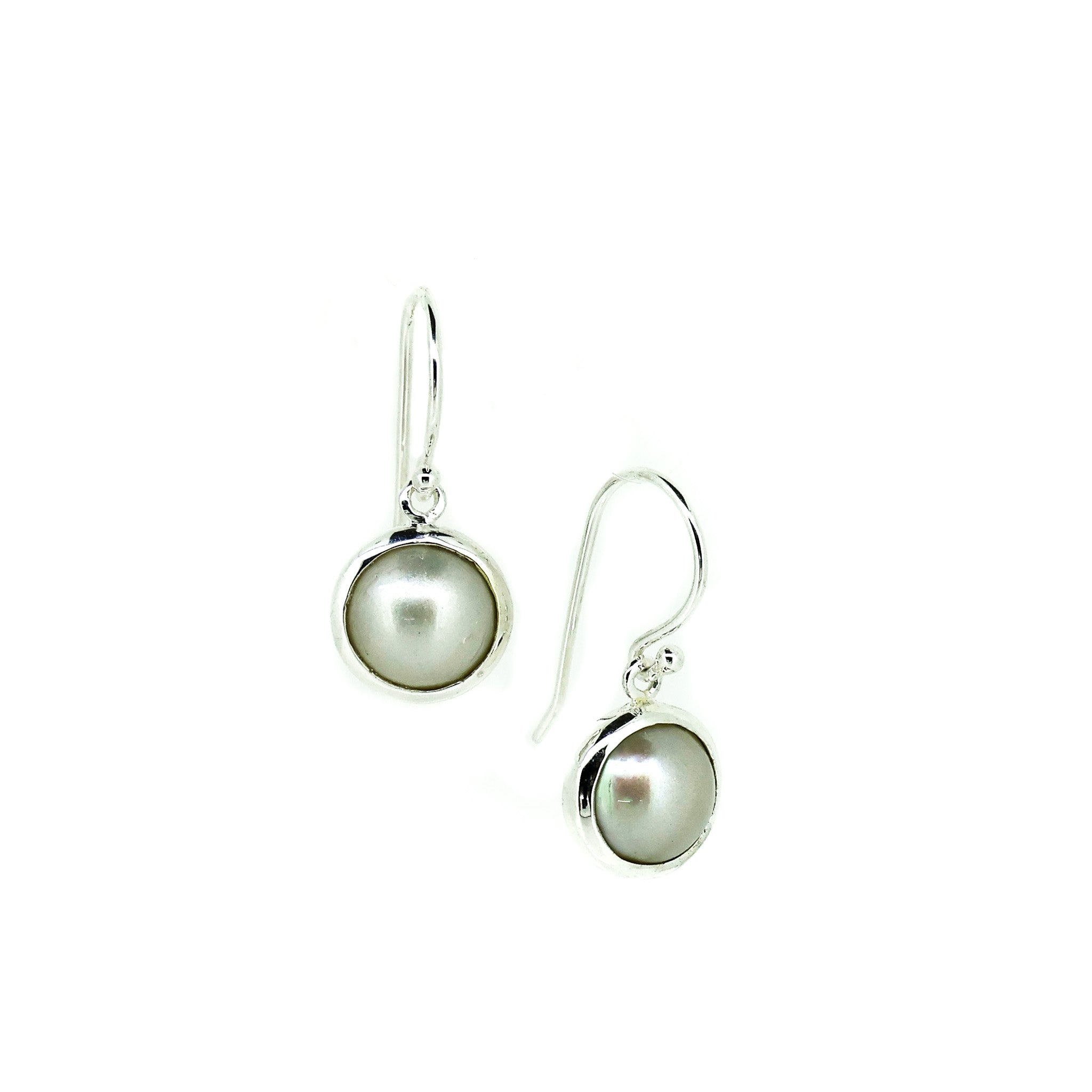 white mabe pearl earrings set in silver