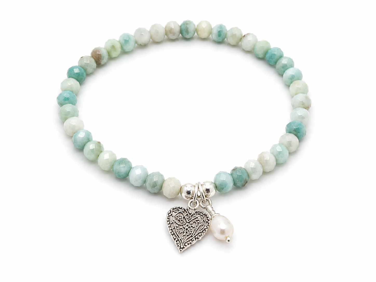Ocean Hearts Larimar Stretch Bracelet featuring genuine Larimar gemstones, freshwater pearl charm and sterling silver heart charm.