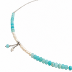 Ocean Spell Pearl Necklace Light Blue Apatite Silver featuring faceted light blue apatite gemstones, genuine white freshwater pearls, delicate sterling silver chain and dangling gemstone and pearl charms. Coastal-inspired jewellery designed by Lush Designs Jewellery in Broome, Western Australia.