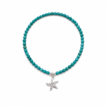 Ocean Spell Stretch Bracelet with turquoise gemstones and sterling silver starfish charm on a stretch bracelet design.
