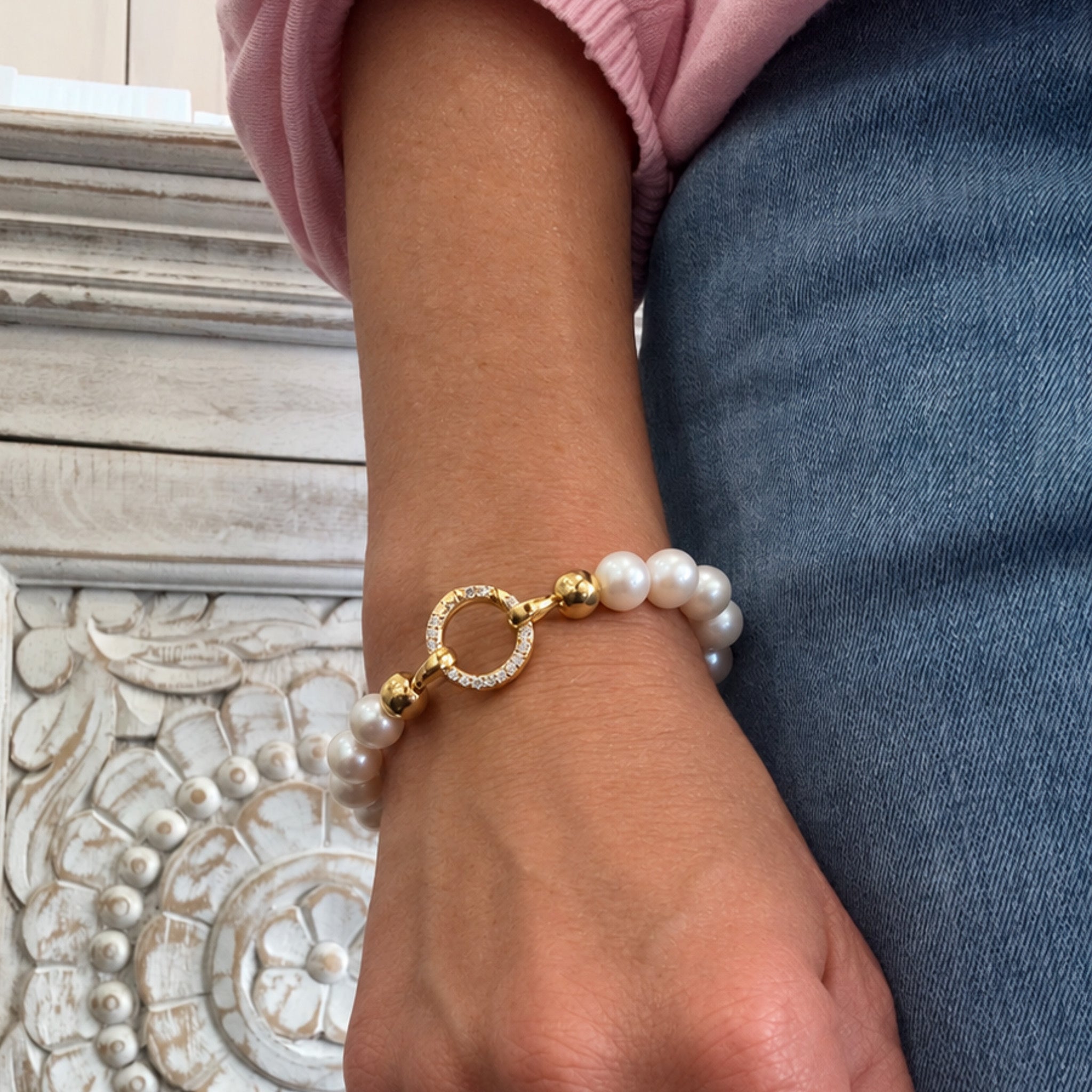 Woman wearing Pearl Silk Knot Bracelet with 10mm freshwater pearls and gold vermeil cubic zirconia clasp