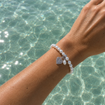 Pearl Silk Knot Bracelet Heart Pearl Charm featuring genuine freshwater pearls and a sterling silver heart charm.