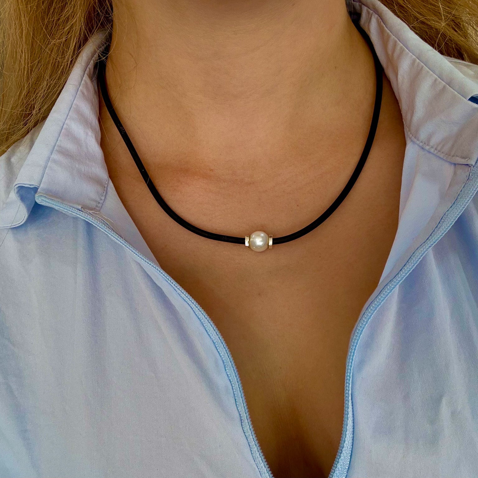 pearl necklace on black neoprene