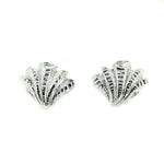 Bold sterling silver shell stud earrings with detailed textured coastal shell design inspired by European summer beach jewellery.