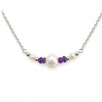 dainty silver chain necklace detailed with pearl and amethysts gemstones
