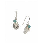 Close-up of faceted blue larimar, freshwater pearl and sterling silver feather Sea Gypsy earrings
I
