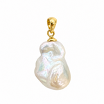 Seeded baroque freshwater pearl pendant featuring a large, naturally irregular white pearl with beautiful iridescent lustre and an 18k gold vermeil bail. Designed by Lush Designs Jewellery in Broome, Western Australia.