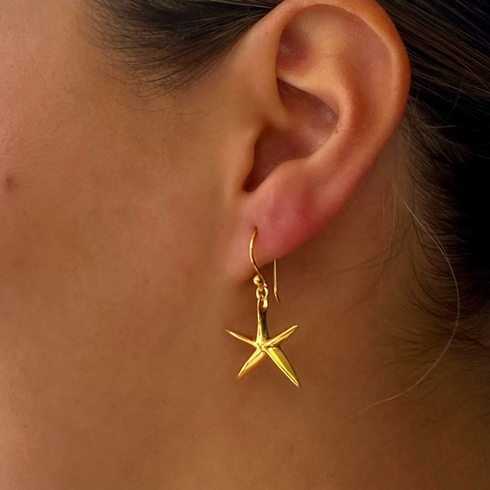 gold starfish earrings