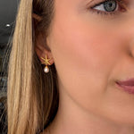 starfish studs in gold with pearl