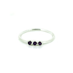 dainty silver ring with amethyst gemstones
