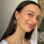 bold gold pearl studs earrings