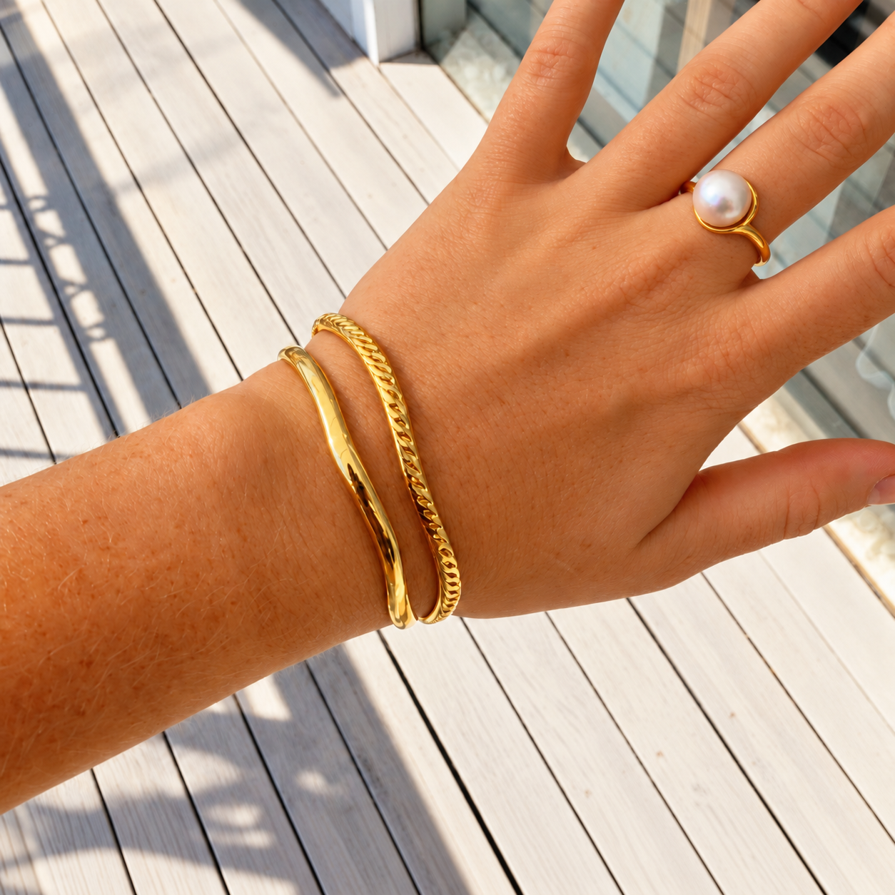 gold bangle in a wave design by Lush designs jewellery broome western australia
