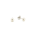 white freshwater pearl studs 4mm in size set in sterling silver by lush designs jewellery broome