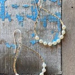 Boho Pearl Loop earrings in 925 sterling silver with hammered open loop and freshwater pearls designed in Broome Western Australia
