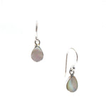 A pair of small dew drop earrings with mother of pearl design, suspended from silver hooks.