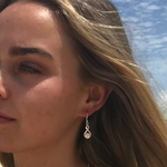 Infinity swirl silver hook earrings with pearl attached 