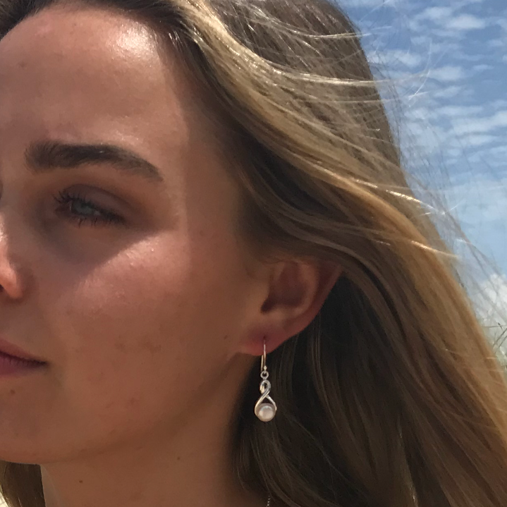 Infinity swirl silver hook earrings with pearl attached 