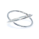 A sterling silver ring with an infinity symbol design, Crafted with a sleek and minimalist style.