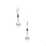 A pair of sterling silver hook earrings featuring Keshi pearl drops.