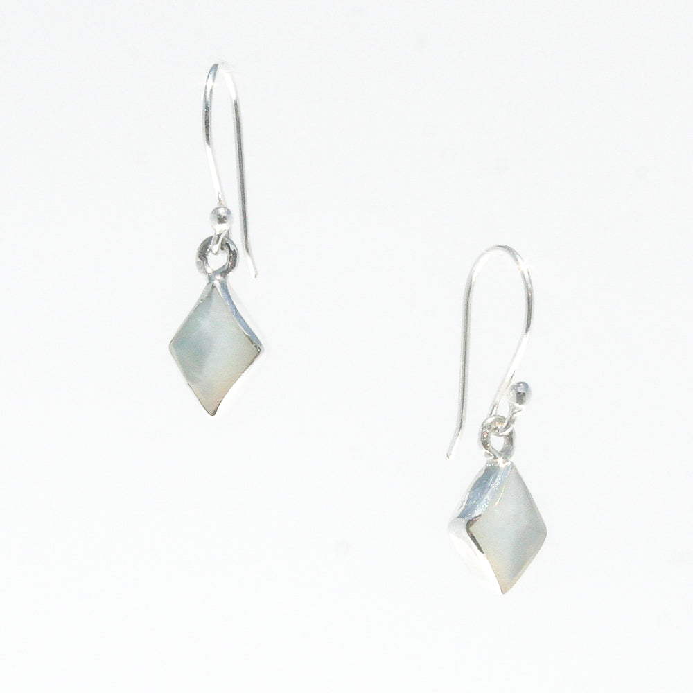 A pair of diamond-shaped mother of pearl earrings with shepherds hooks, set in hypo-allergenic sterling silver, on a white background.