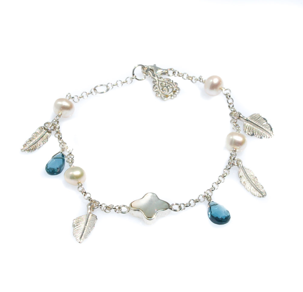 Ocean Breeze Pearl Bracelet Topaz crafted in premium 925 sterling silver featuring genuine freshwater pearls paired with sparkling blue topaz gemstones in a coastal-inspired bracelet design.