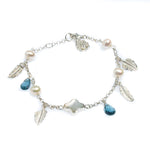 Ocean Breeze Pearl Bracelet Topaz crafted in premium 925 sterling silver featuring genuine freshwater pearls paired with sparkling blue topaz gemstones in a coastal-inspired bracelet design.