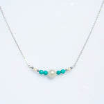 Sea Dreams pearl necklace with blue apatite gemstones and freshwater pearls in sterling silver