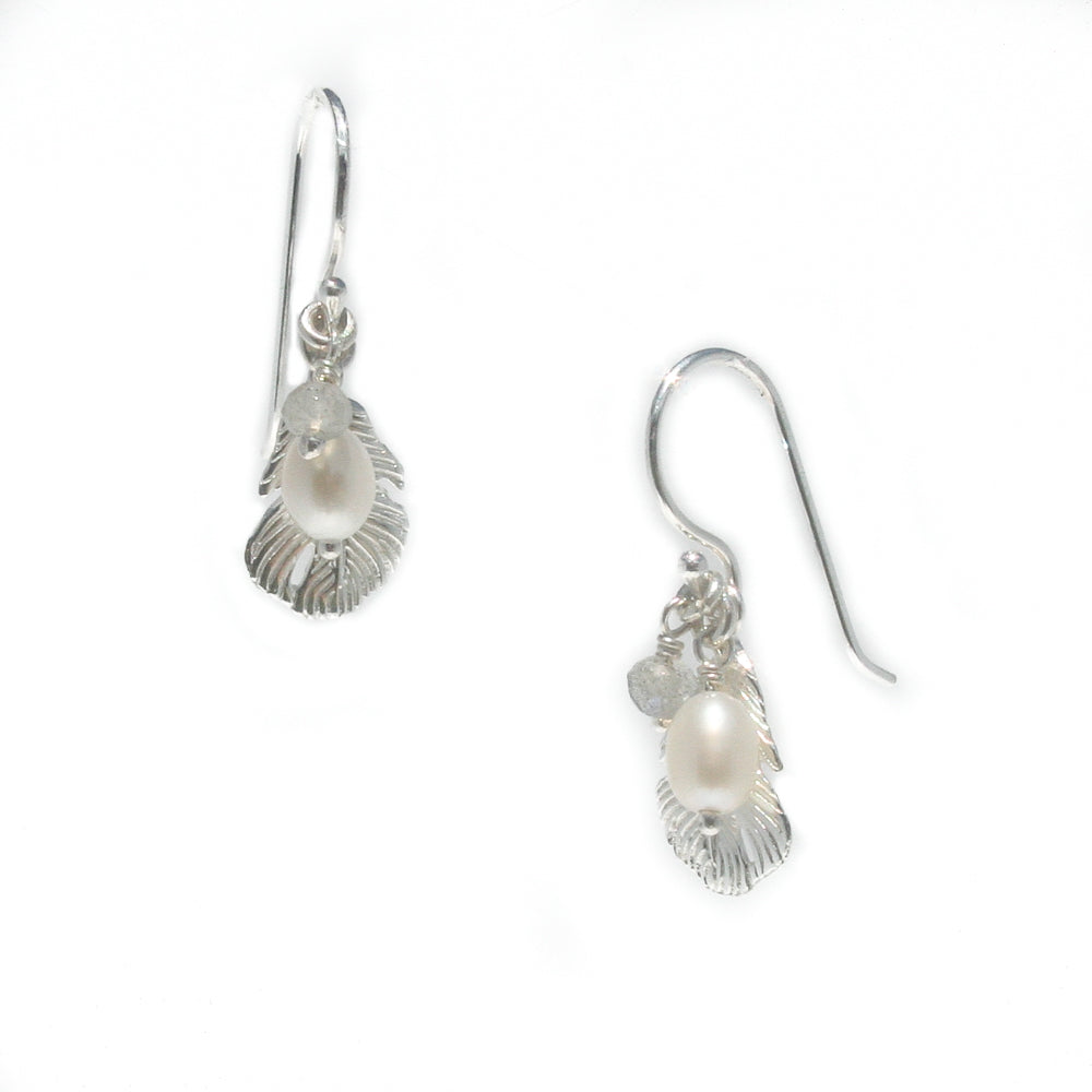 A pair of sterling silver pearl earrings with labradorite details, designed to resemble seashells.