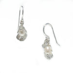 A pair of sterling silver pearl earrings with labradorite details, designed to resemble seashells.