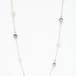 Sea Pearl Topaz Necklace in sterling silver featuring a genuine freshwater pearl and topaz gemstone.