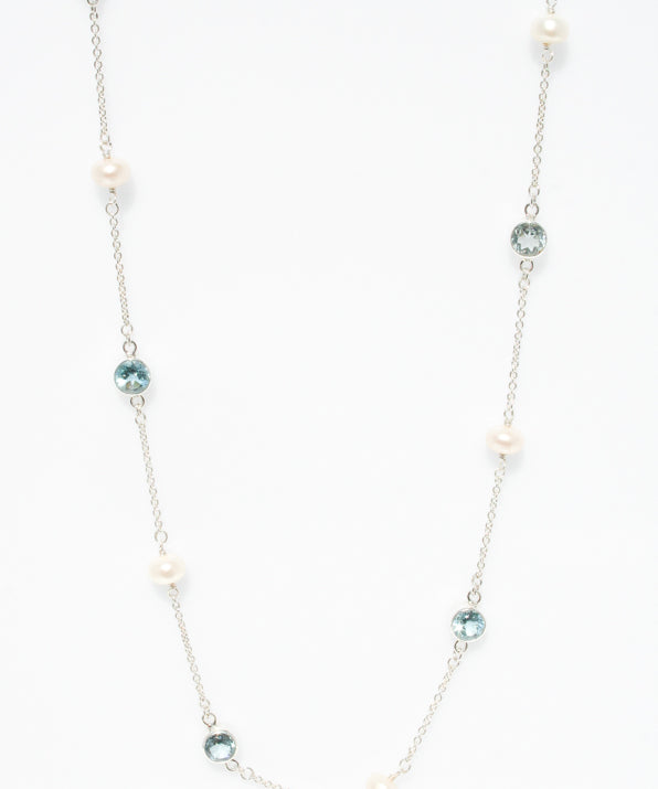 Sea Pearl Topaz Necklace in sterling silver featuring a genuine freshwater pearl and topaz gemstone.