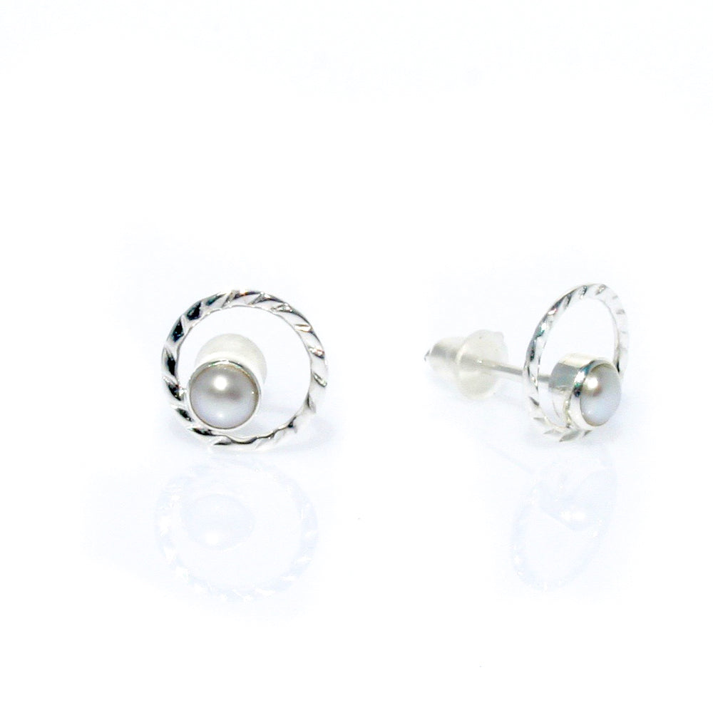 Dainty pearl studs with swirl detailing 