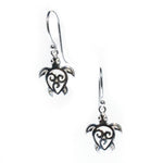 A pair of sterling silver earrings in the shape of a turtle.