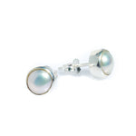 A pair of white pearl stud earrings bezel set in sterling silver.