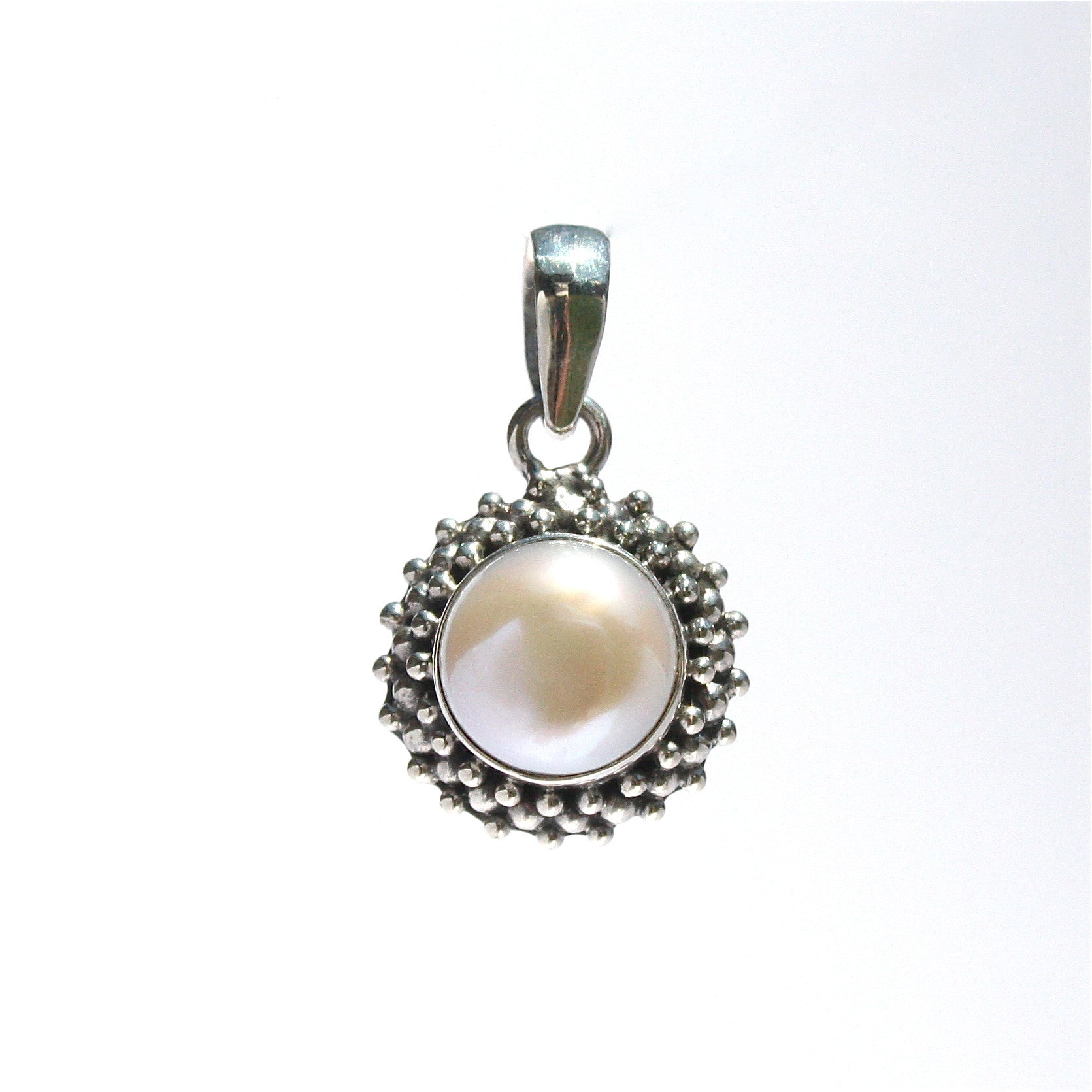 Vintage Pearl Pendant featuring a genuine freshwater pearl with elegant vintage-inspired detailing