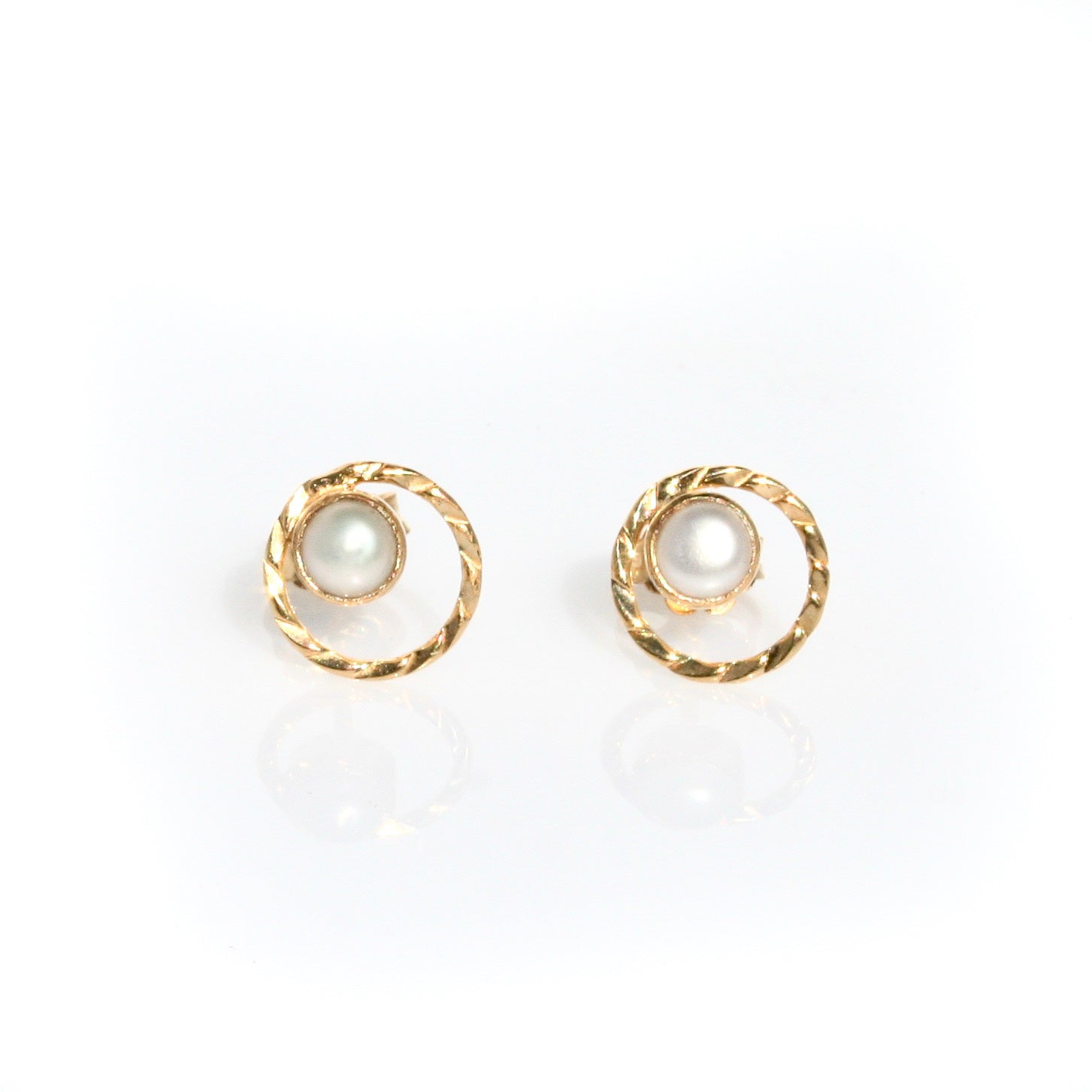 Sunset Swirls Pearl Studs Gold crafted in premium gold vermeil over sterling silver featuring genuine freshwater pearls with flowing swirl details.